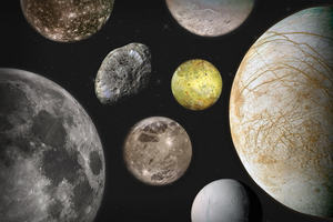 A collection of moons of different sizes and colours floating in space