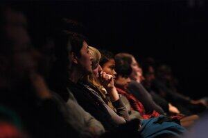 Audience in a cinema watching a film
