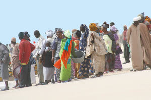 People waiting for the return of boats on the Plage des Pêcheurs in Nouakchott, Mauritania. Photo courtesy of Dr Jérôme Chenal. Reproduced in Jérôme Chenal, The West African City: Urban space and models of urban planning (Lausanne: EPFL Press, 2014), 156.