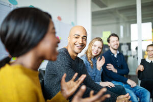 Group of diverse business people talking in a meeting. Business team smiling during a meeting.