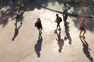 Sunlight shining on people in public outdoor space