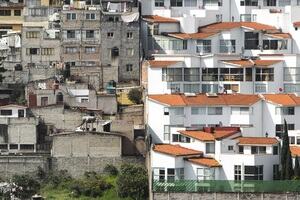 Socioeconomically disadvantaged housing juxtaposed against luxury accommodation
