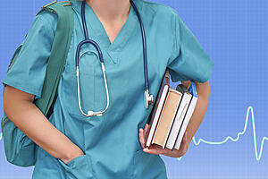 Young female nurse or intern surgeon in blue uniform with books and bag on blue background electrocardiogram