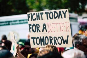 protest sign for climate action that says 'fight today for a better tomorrow'.